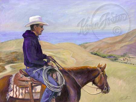The cattle boss on a red horse with a western saddle and a colorful indain blanket is whiching the hillside that is a yellow grasses colored and the ocean is in the background. 