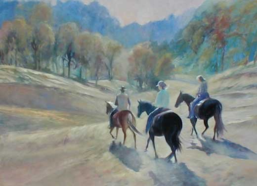 Three horse back riders, riding away from he viewer, towards the trees and mountains and the light.