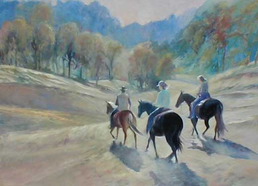 Three horse back riders, riding away from he viewer, towards the trees and mountains and the light.