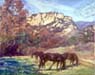 Three horses grazing in a meadow with a rocky formation in the distance.