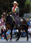 Karen happily riding a Mule in the Paso Robles parade.